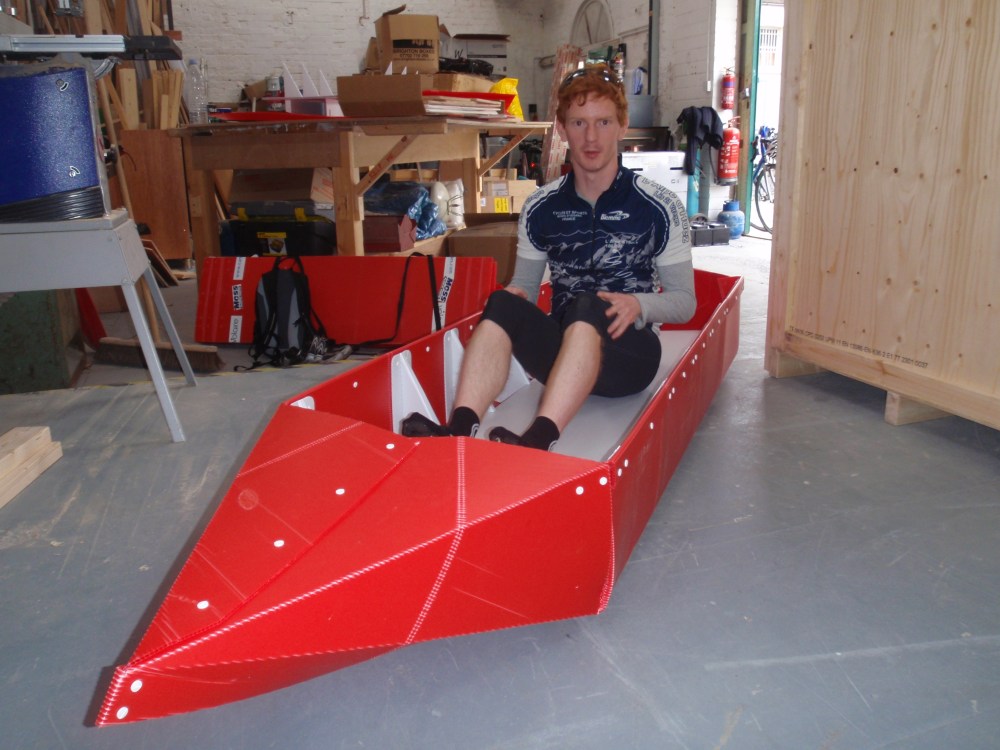 Tom in origami canoe